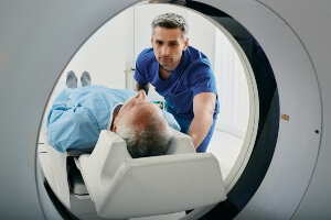 doctor preparing injured man for an MRI