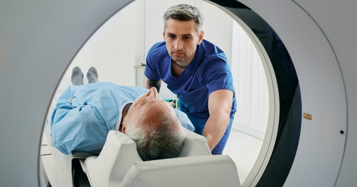 doctor preparing injured man for an MRI