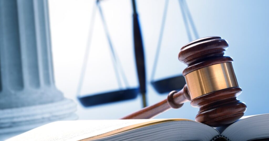 gavel and book on a courtroom desk