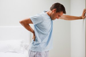 man suffering from back pain