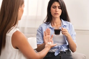 A lady refusing to take pills.