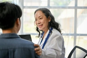 Patient talking to doctor.