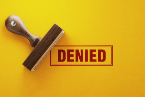 Denied stamp on yellow background