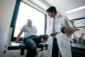 man with a prosthetic leg in a clinic