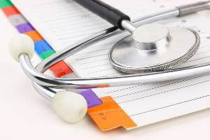medical records with a stethoscope on top