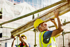 two construction workers in bright sun